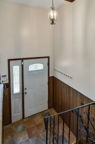 a view of an empty room with window swimming pool