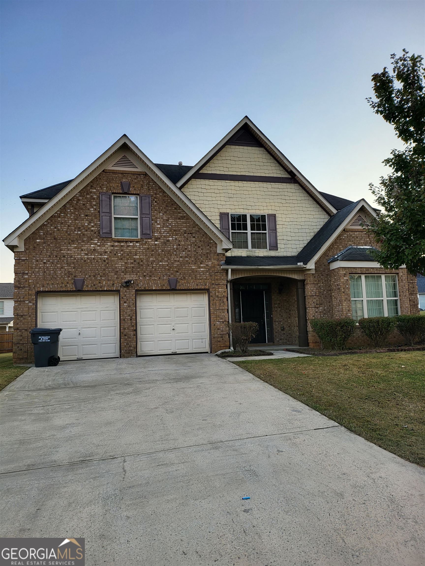 30 Vermillion Way Covington, GA 30016 - Photo 1 of 37 a front view of a house with a yard and garage