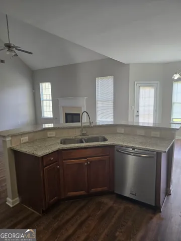 a kitchen with a sink and cabinets