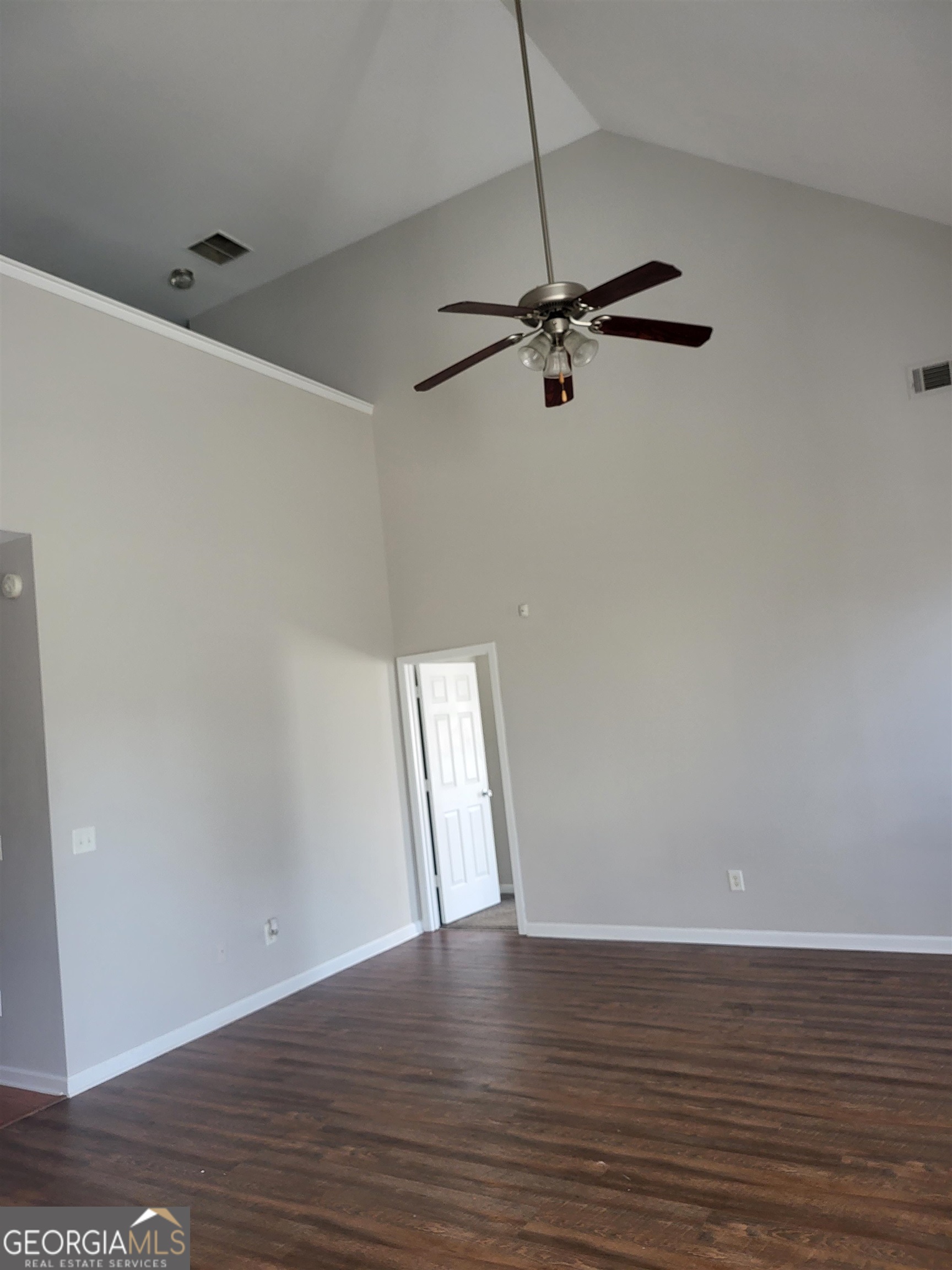30 Vermillion Way Covington, GA 30016 - Photo 14 of 37 a view of an empty room with wooden floor and a ceiling fan
