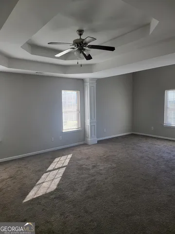 a view of an empty room and window