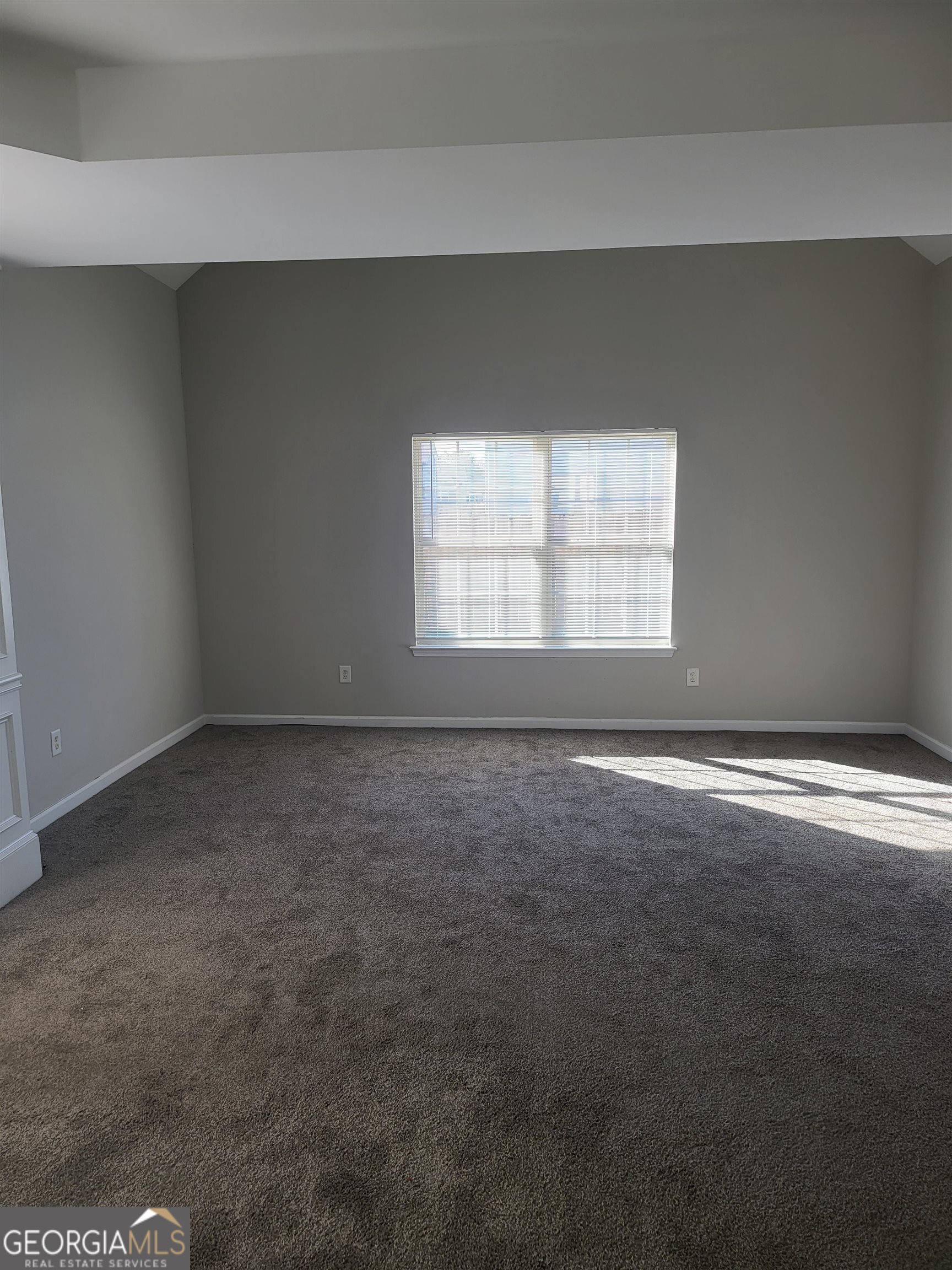 30 Vermillion Way Covington, GA 30016 - Photo 17 of 37 an empty room with a window
