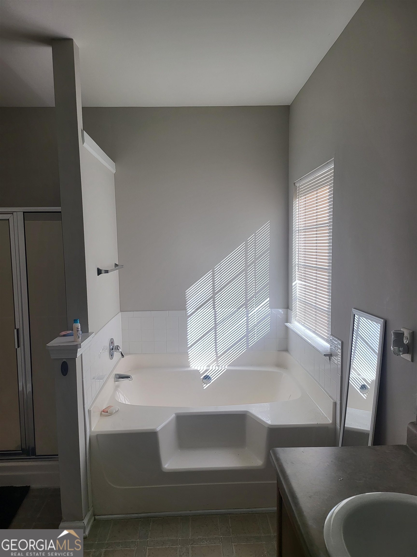 30 Vermillion Way Covington, GA 30016 - Photo 18 of 37 a bathroom with a sink and a bathtub