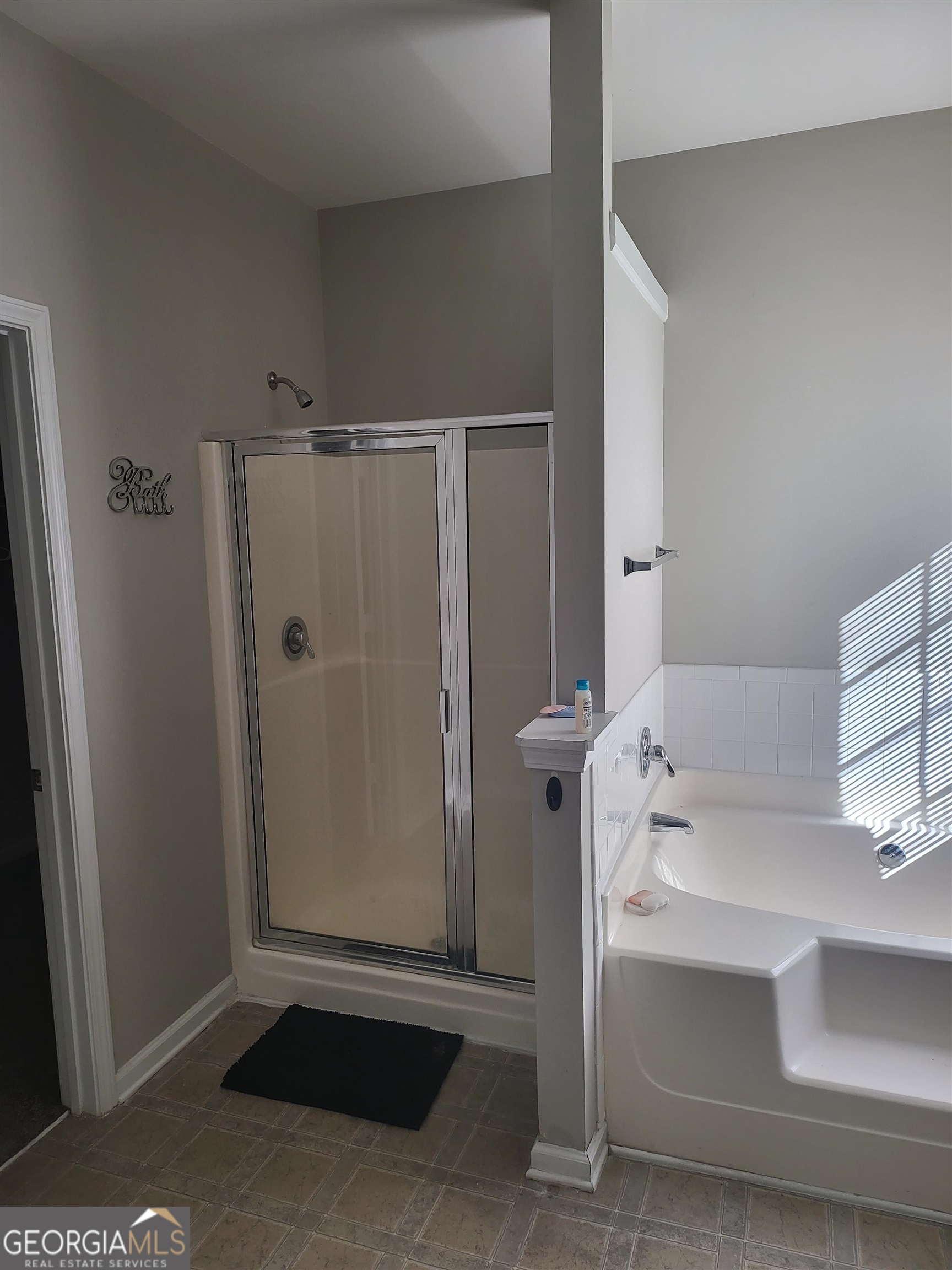 30 Vermillion Way Covington, GA 30016 - Photo 21 of 37 a bathroom with a shower and a sink