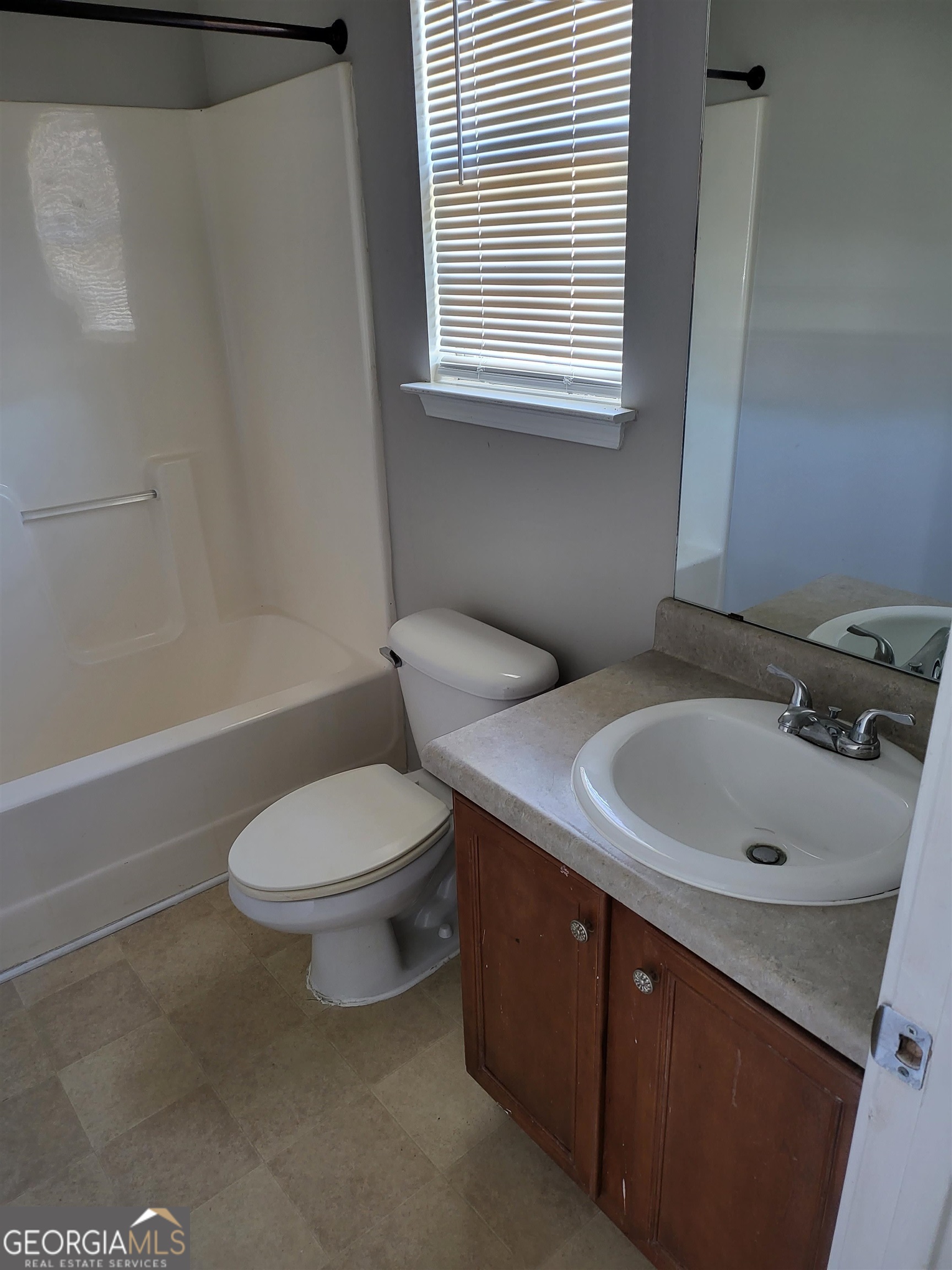 30 Vermillion Way Covington, GA 30016 - Photo 25 of 37 a bathroom with a sink a toilet and a bathtub