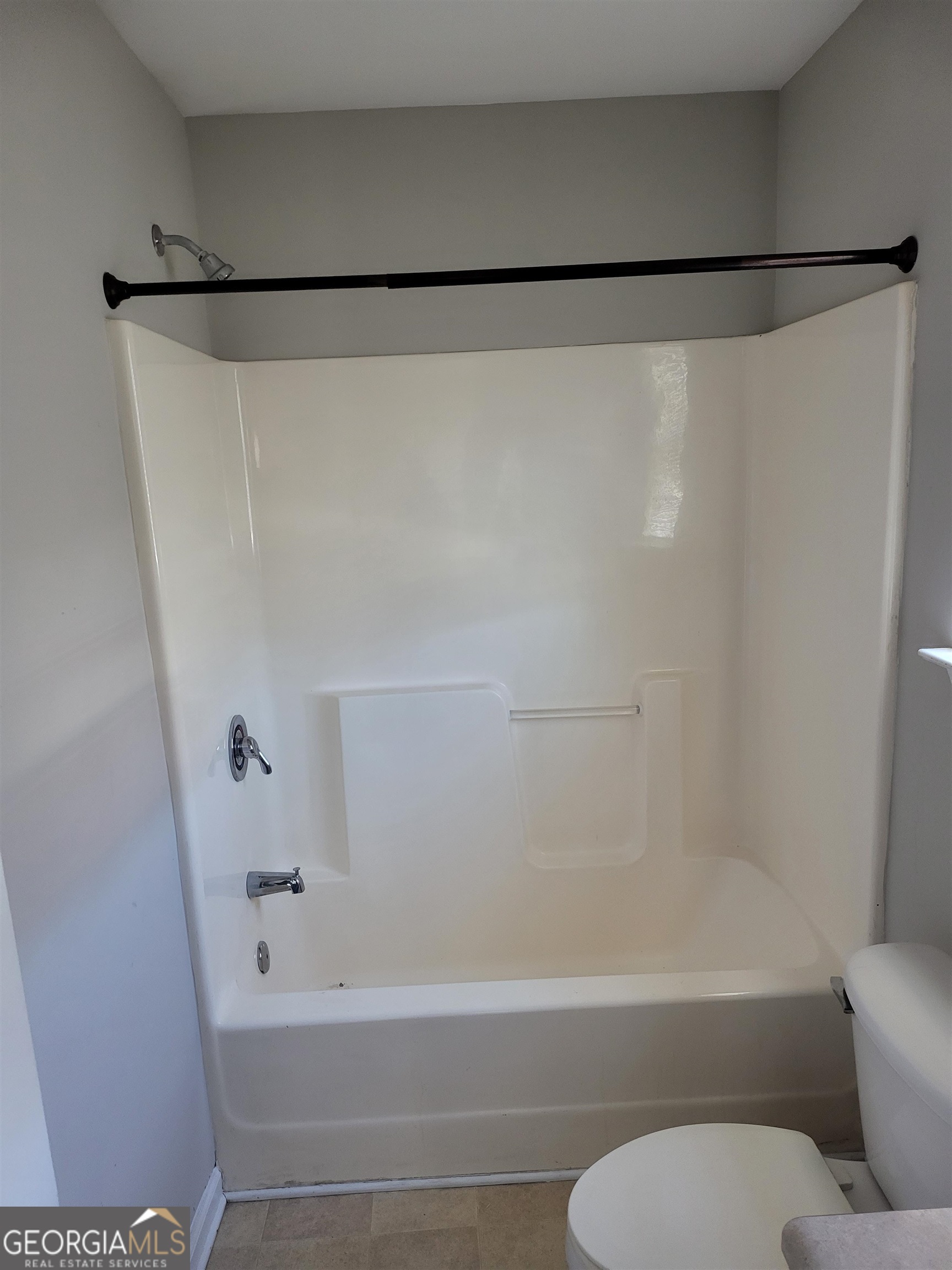 30 Vermillion Way Covington, GA 30016 - Photo 26 of 37 a bathroom with a shower and a toilet