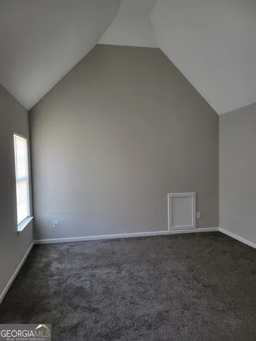 an empty room with a empty space and window