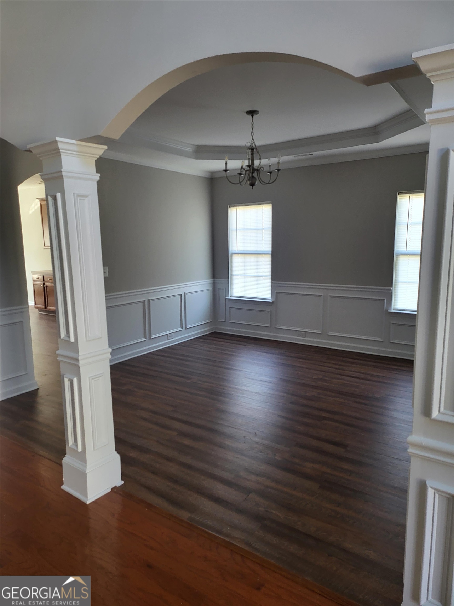 30 Vermillion Way Covington, GA 30016 - Photo 6 of 37 an empty room with wooden floor and windows