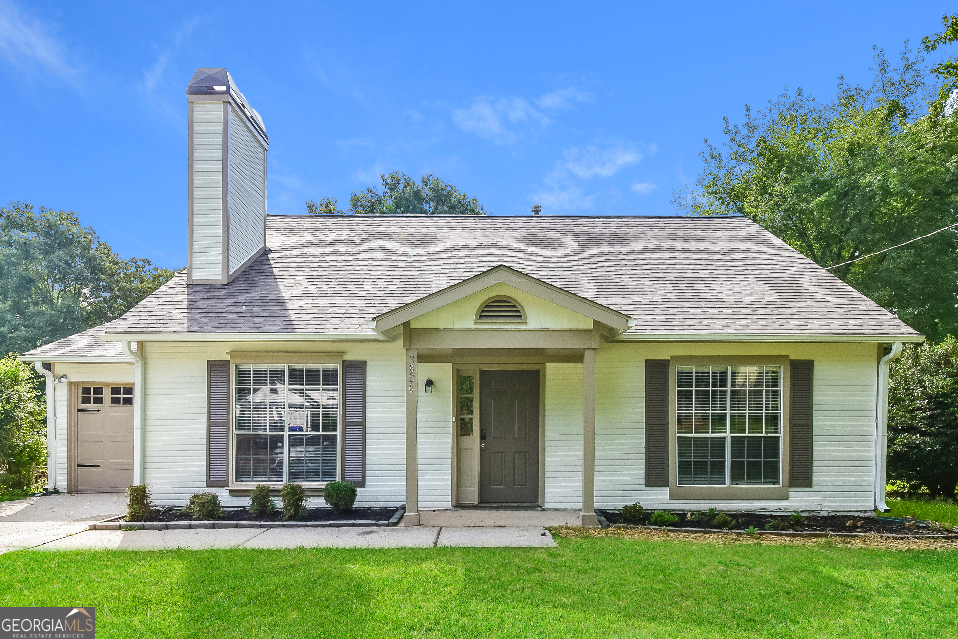 front view of a house with a yard