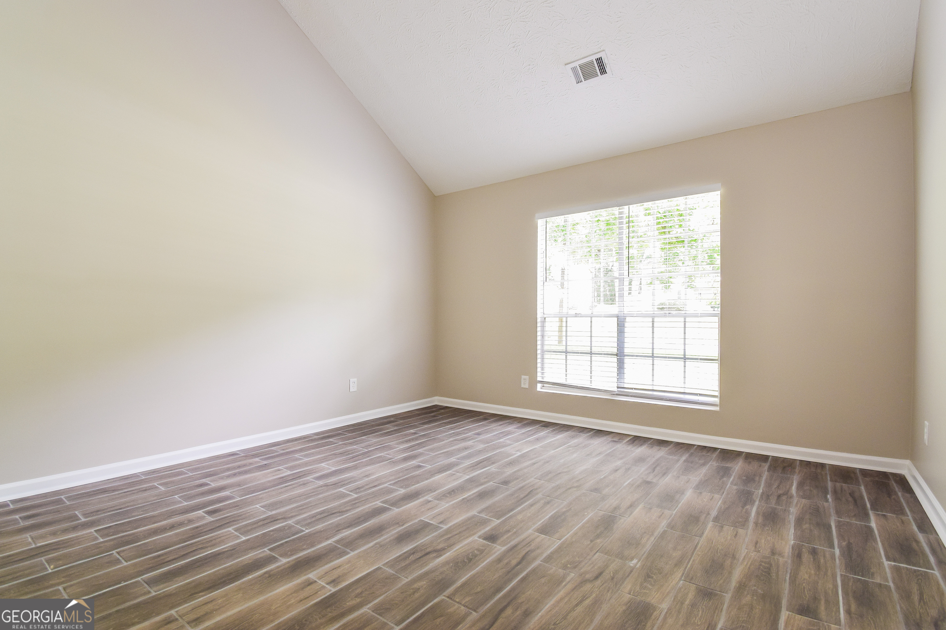 2826 Knollberry Lane Decatur, GA 30034 - Photo 11 of 17 wooden floor in an empty room with a window