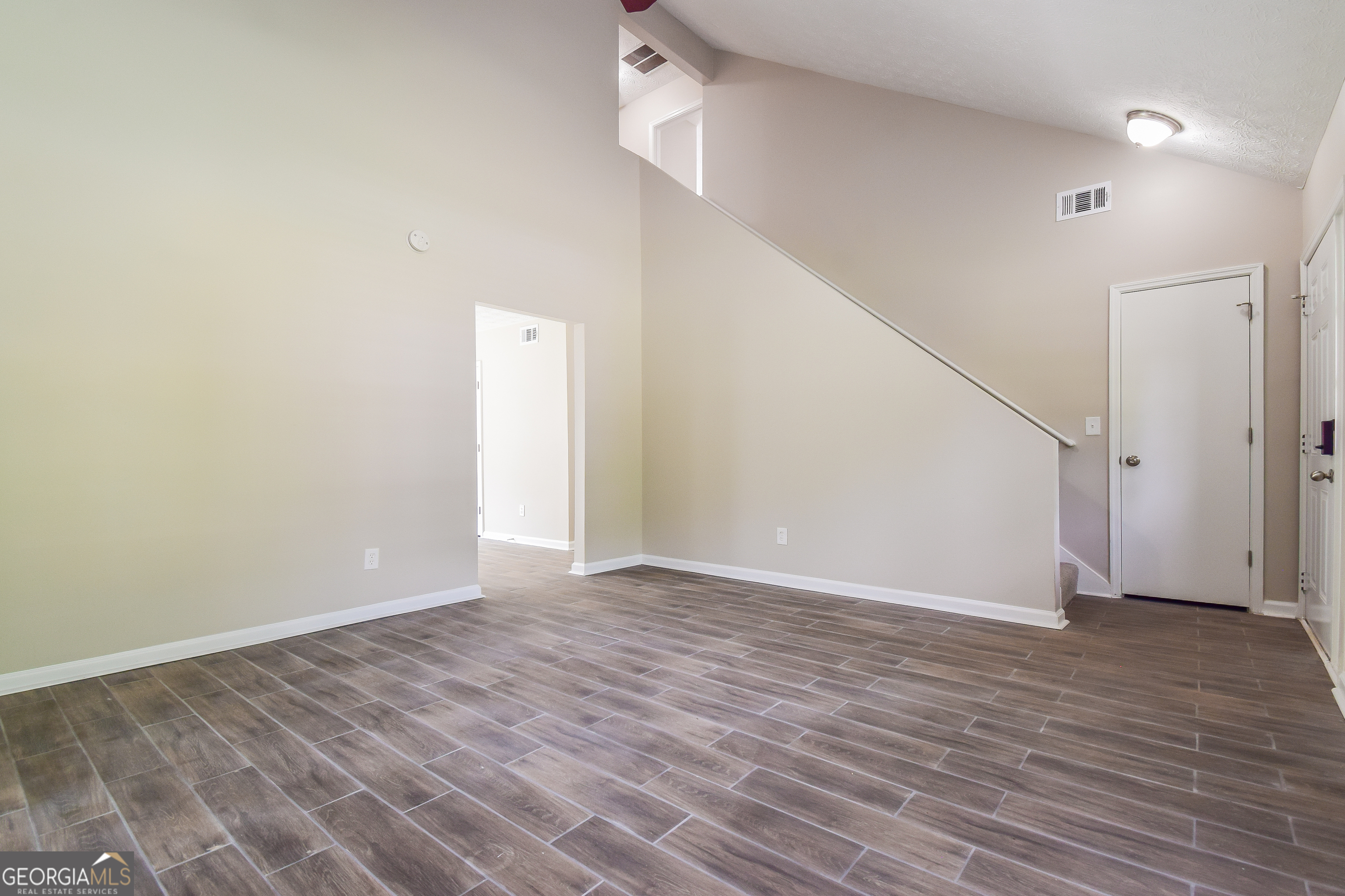 2826 Knollberry Lane Decatur, GA 30034 - Photo 2 of 17 a view of an empty room with wooden floor