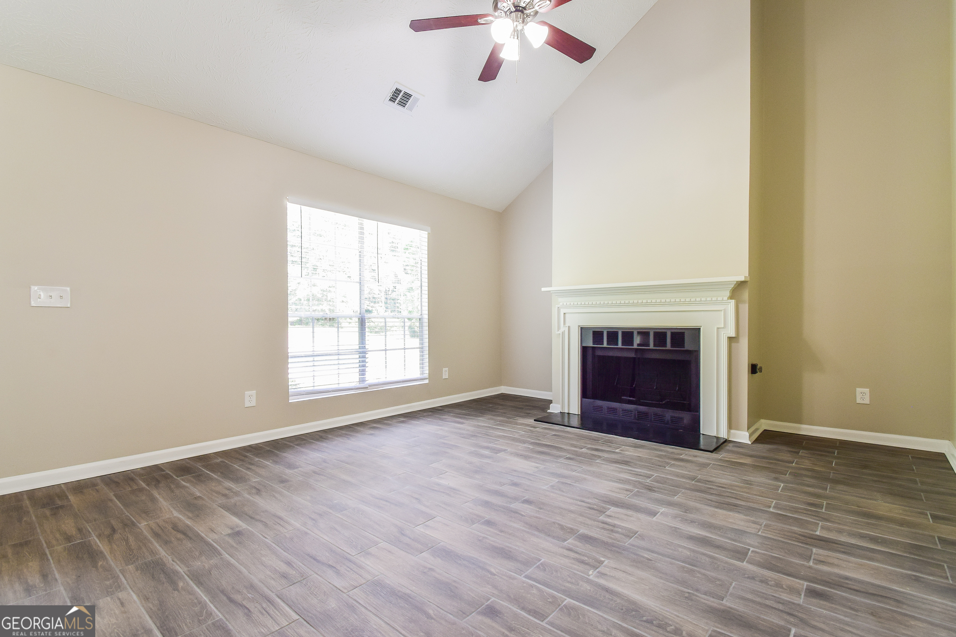 2826 Knollberry Lane Decatur, GA 30034 - Photo 3 of 17 wooden floor fireplace and windows in an empty room