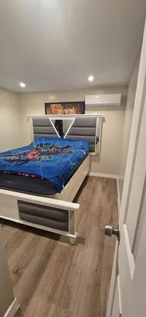 a living room with a furniture and a rug