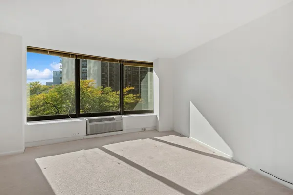 a view of a room with a large window