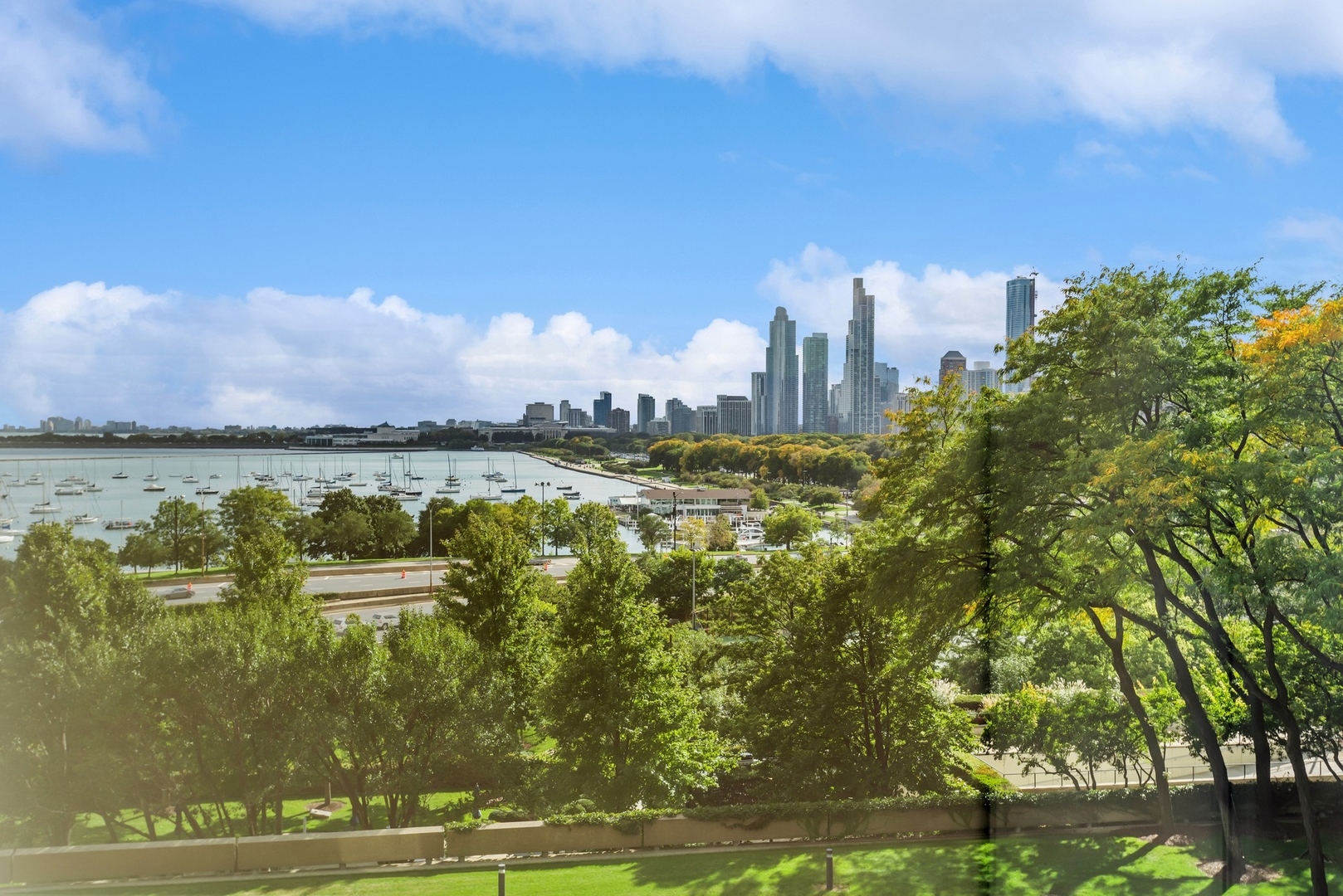 155 North Harbor Drive, Unit 403 Chicago, IL 60601 - Photo 14 of 24 a view of a lake with houses in the background