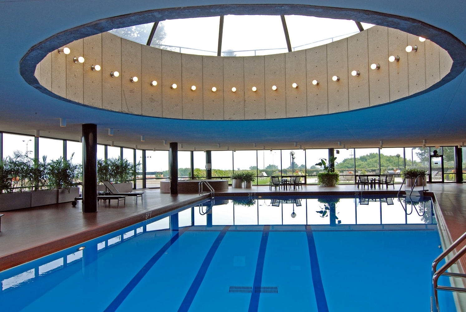 155 North Harbor Drive, Unit 403 Chicago, IL 60601 - Photo 15 of 24 a kitchen with stainless steel appliances dining table chairs and view living room