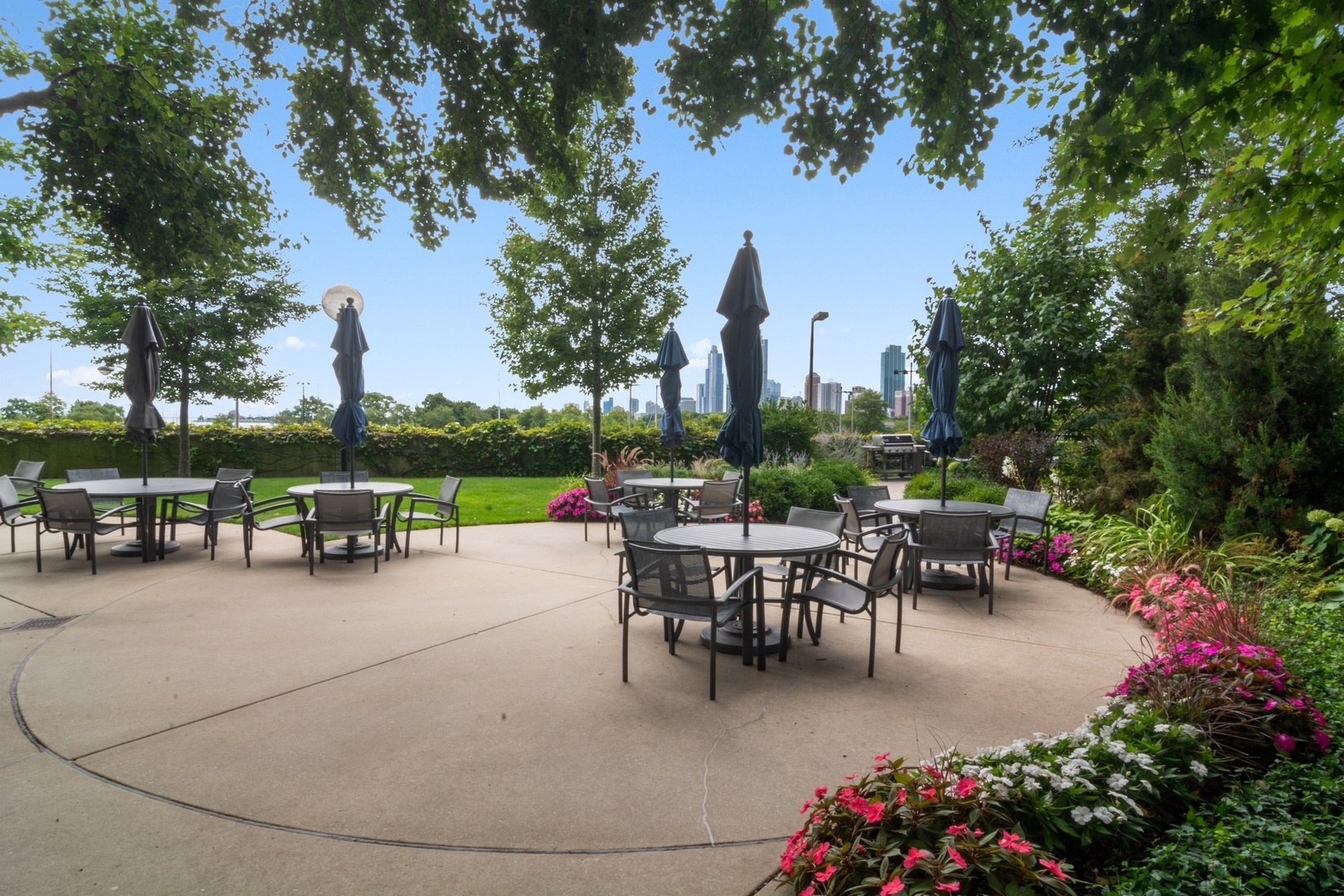 155 North Harbor Drive, Unit 403 Chicago, IL 60601 - Photo 20 of 24 a view of a patio with couches and table and chairs and potted plants