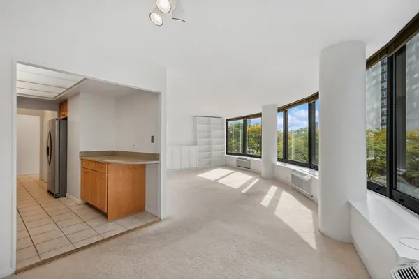 a view of an empty room and window