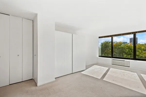 a view of a room with a large window