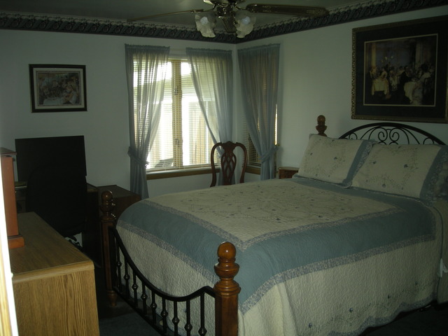 800 Westminster Road Joliet, IL 60435 - Photo 8 of 25 a bedroom with a bed and a window
