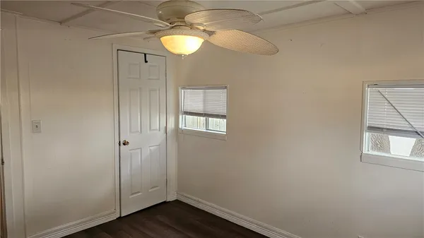 a view of room with wooden floor