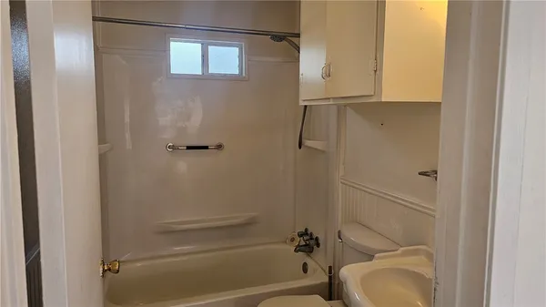 a bathroom with a granite countertop sink