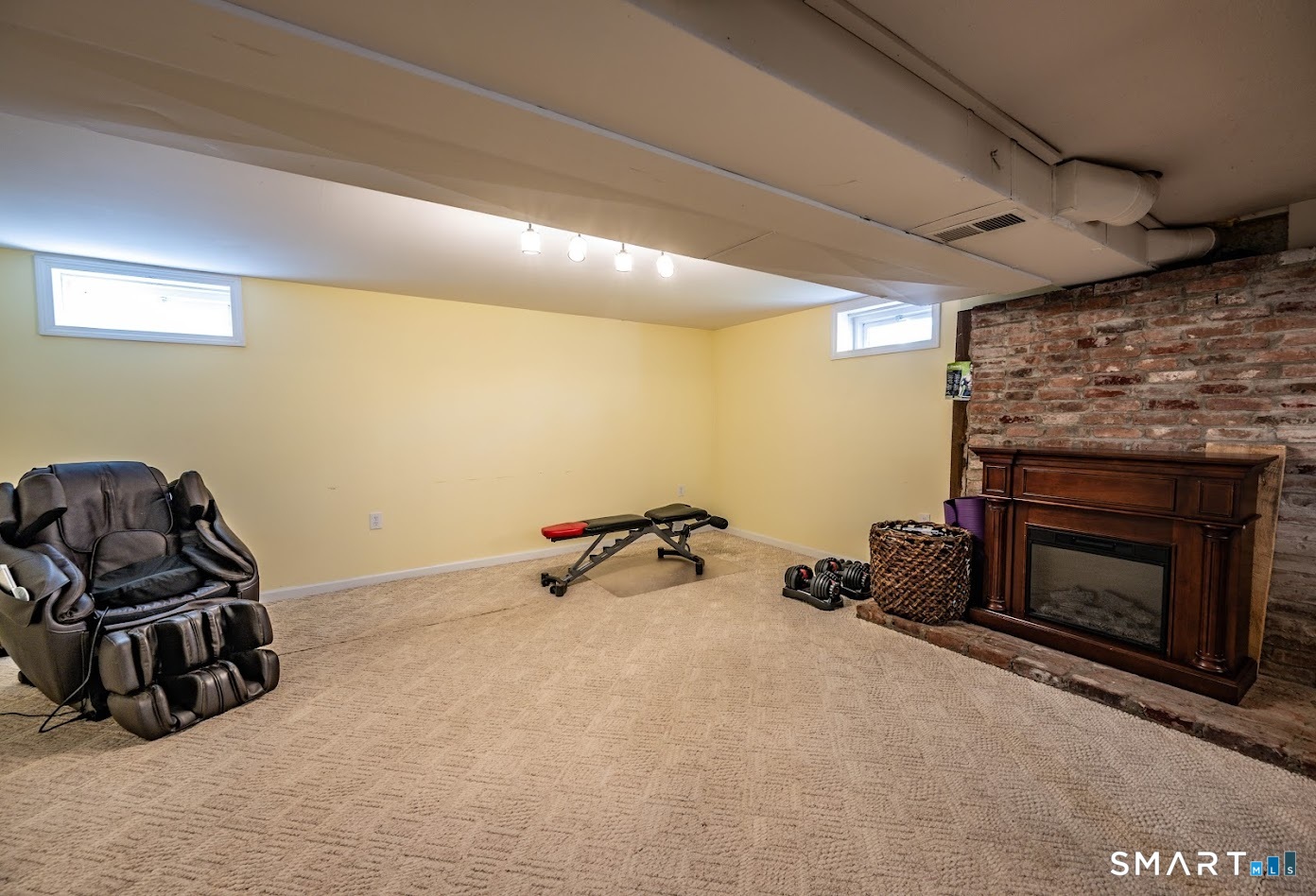 193 R Blue Hills Road Durham, CT 06422 - Photo 22 of 30 a room with furniture and a fireplace