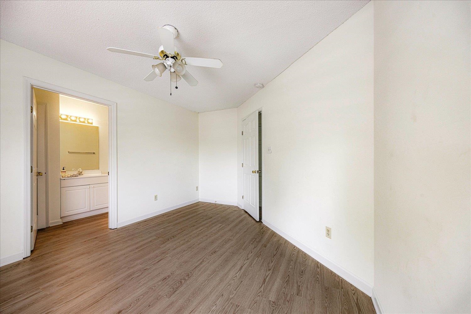 7944 Anne's Circle Memphis, TN 38018 - Photo 11 of 27 a view of a room with wooden floor and a ceiling fan
