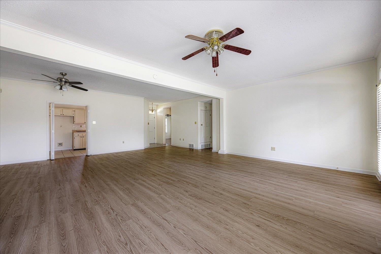 7944 Anne's Circle Memphis, TN 38018 - Photo 13 of 27 wooden floor in an empty room with a window