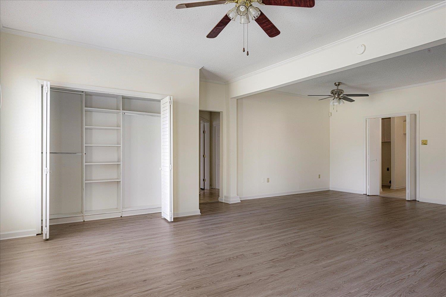 7944 Anne's Circle Memphis, TN 38018 - Photo 15 of 27 an empty room with wooden floor closet ceiling fan and windows