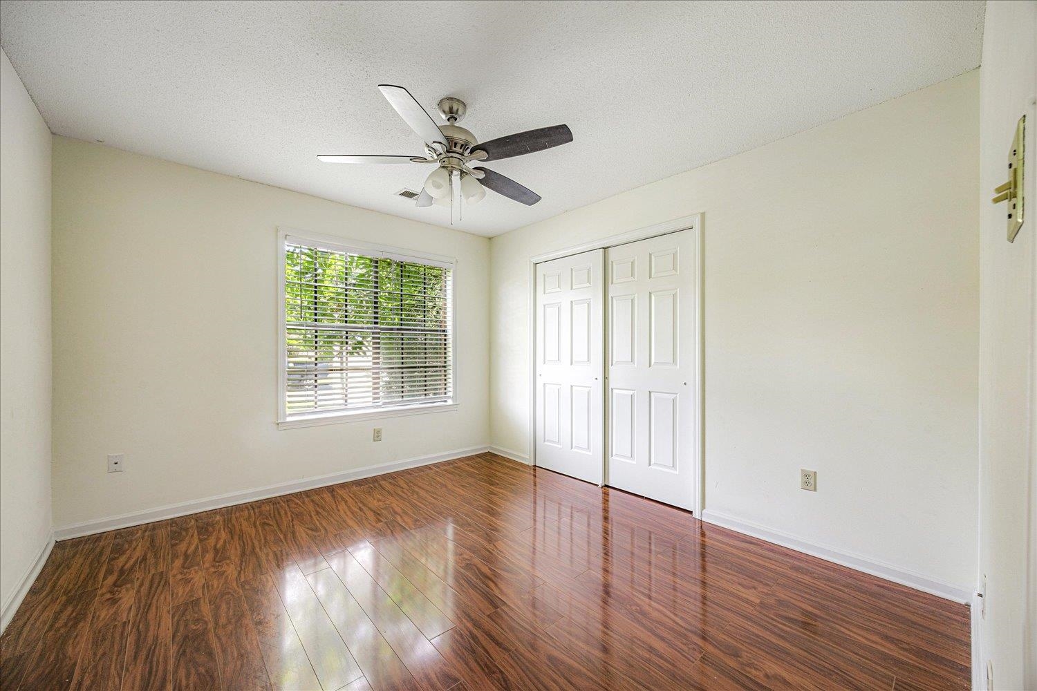 7944 Anne's Circle Memphis, TN 38018 - Photo 20 of 27 a view of empty room with wooden floor and fan