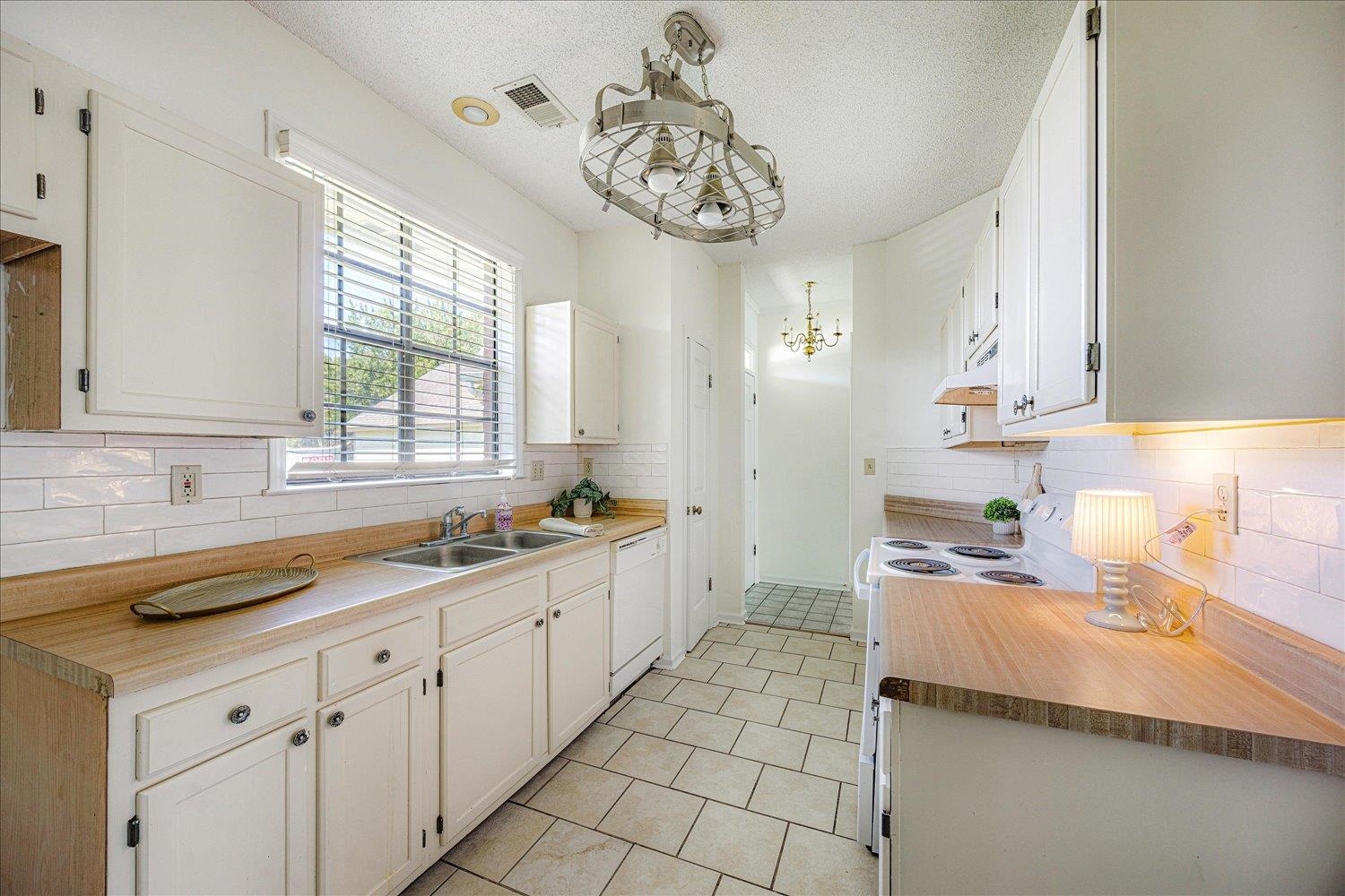 7944 Anne's Circle Memphis, TN 38018 - Photo 9 of 27 a kitchen with a sink cabinets and window