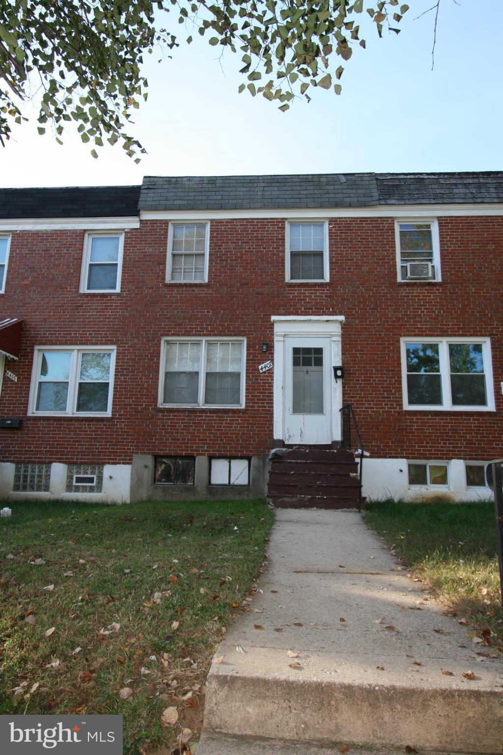 4407 Cedar Garden Road Baltimore, MD 21229 - Photo 2 of 30 a front view of a house with garden