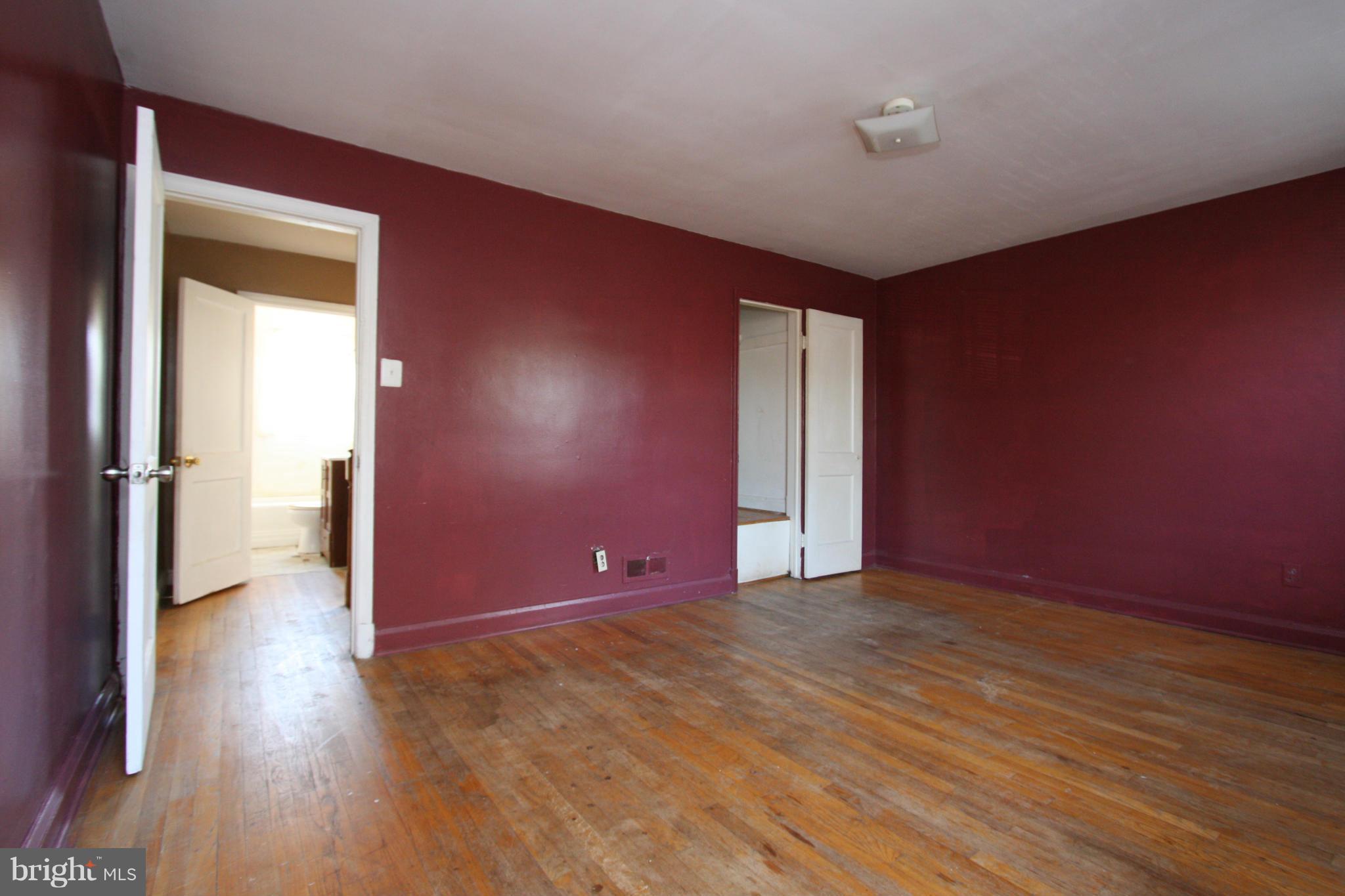 4407 Cedar Garden Road Baltimore, MD 21229 - Photo 12 of 30 a view of empty room with wooden floor