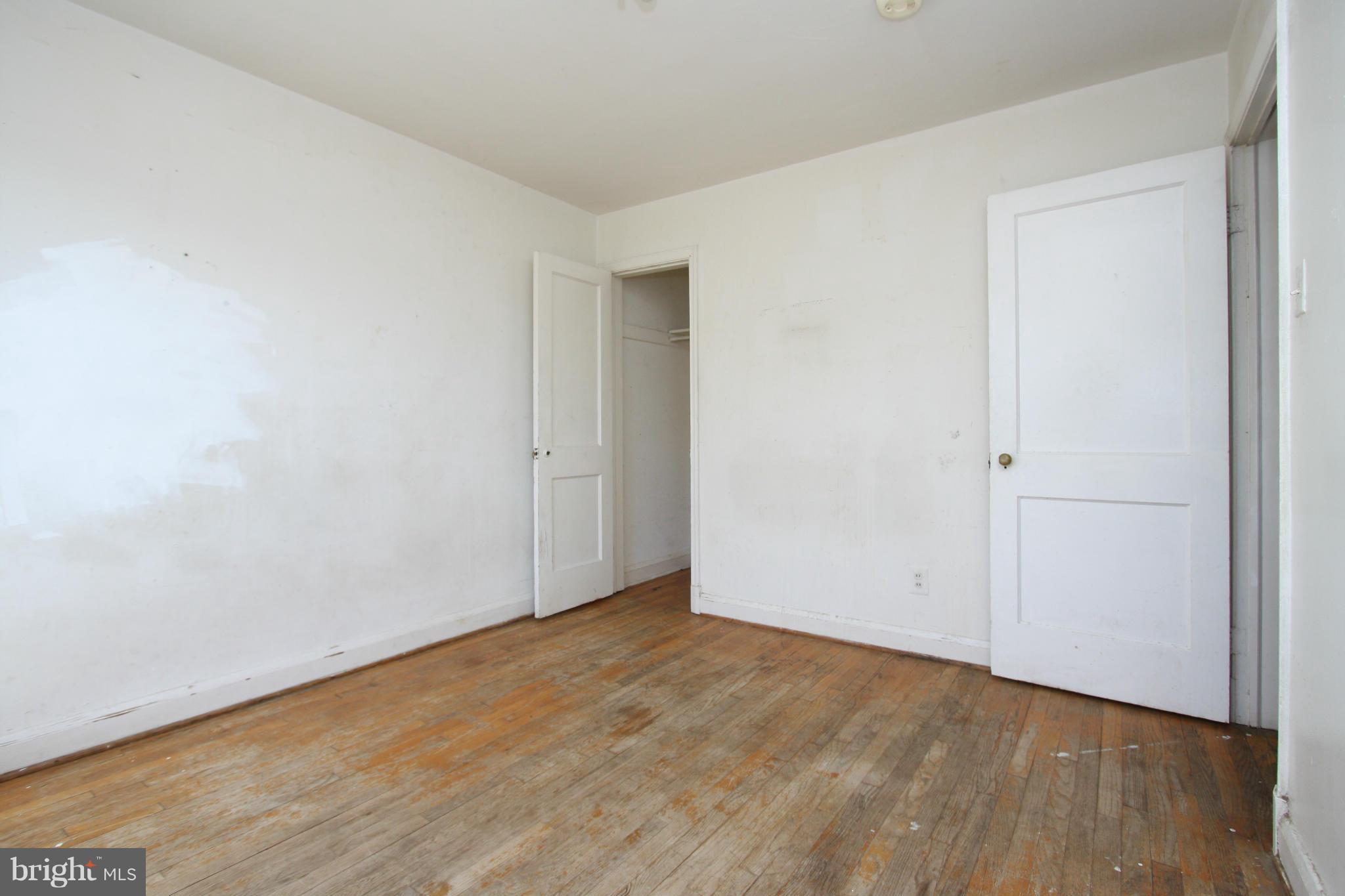 4407 Cedar Garden Road Baltimore, MD 21229 - Photo 15 of 30 an empty room with wooden floor
