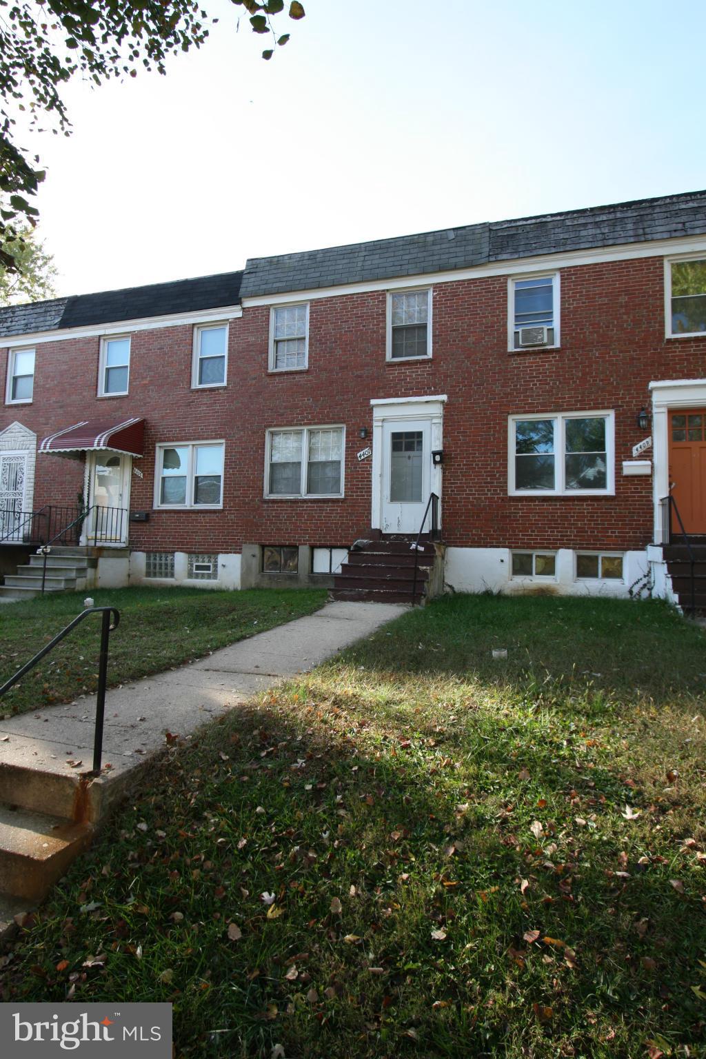4407 Cedar Garden Road Baltimore, MD 21229 - Photo 3 of 30 a front view of a house with a yard