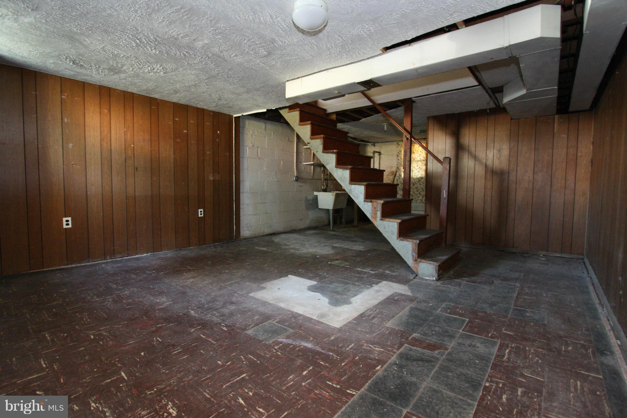 4407 Cedar Garden Road Baltimore, MD 21229 - Photo 22 of 30 a view of an empty room with stairs
