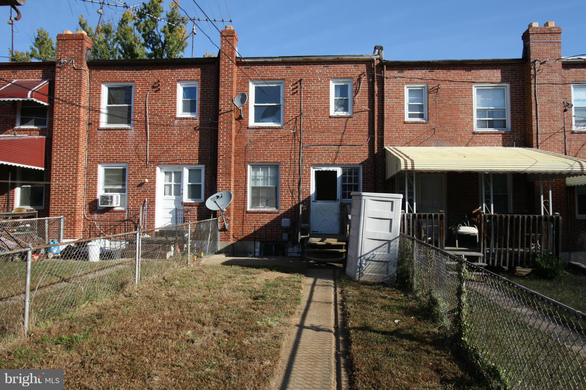 4407 Cedar Garden Road Baltimore, MD 21229 - Photo 27 of 30 a front view of a house with yard