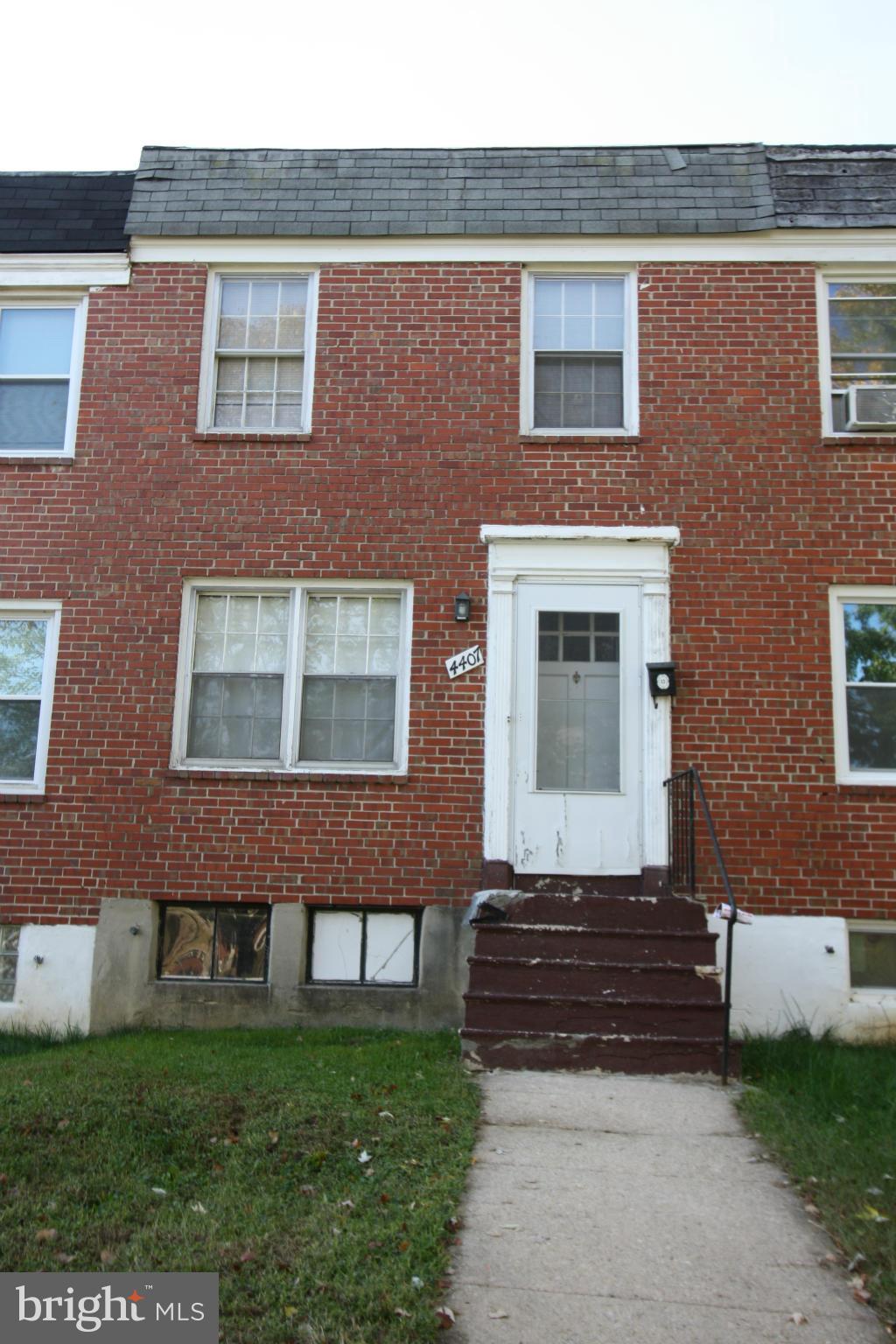 4407 Cedar Garden Road Baltimore, MD 21229 - Photo 30 of 30 a view of a brick building with many windows and a yard
