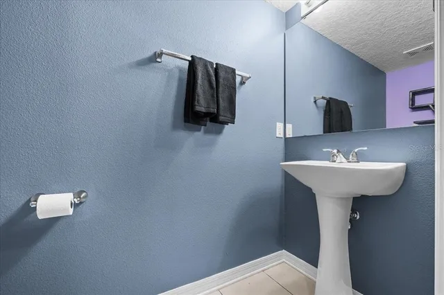 a view of a room with wooden floor and furniture