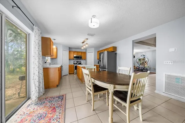 a spacious bedroom with a bed and a cabinets
