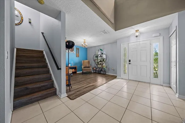 a bed room with a bed and a television