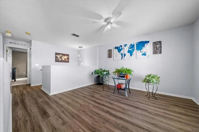 a bathroom with a toilet and a shower curtain