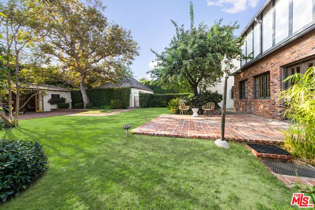 a view of a house with a yard porch and sitting area