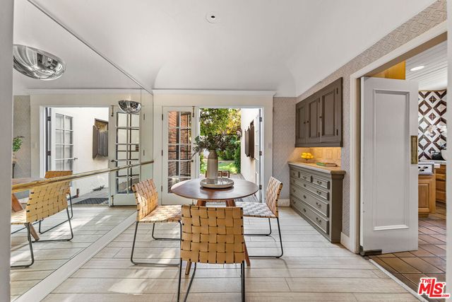 a living room with furniture a fireplace and a table