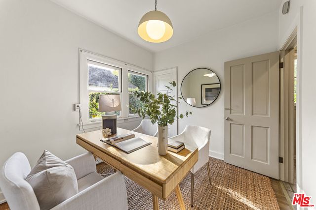 a view of a workspace with furniture