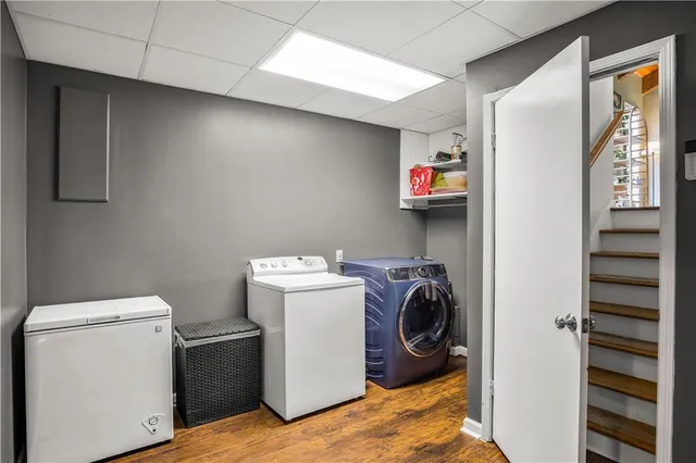 a view of storage and utility room with washer and dryer