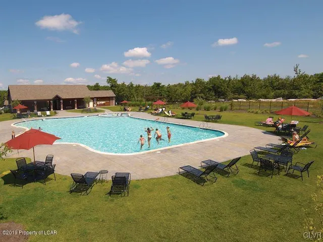 a view of a lake with a yard