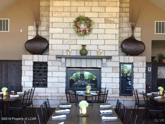 a living room with fireplace furniture and a fireplace