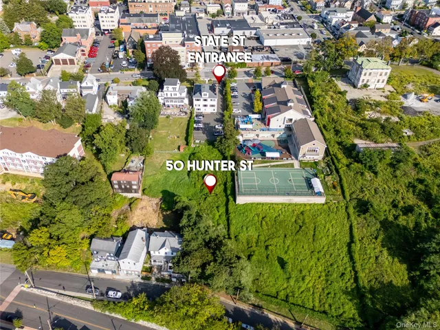 an aerial view of residential houses with outdoor space